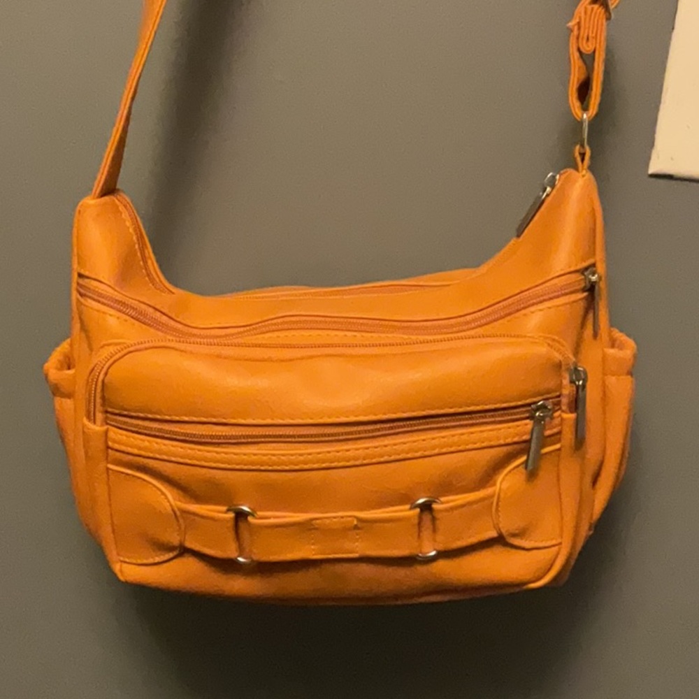 NWOT Tangerine Color purse. Lots Of Pockets